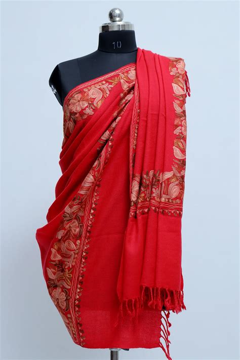 Ravishing red colour base with four sided running border is a perfect