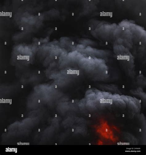 Dramatic black clouds of strong fire smoke covered sky. Defocus and ...