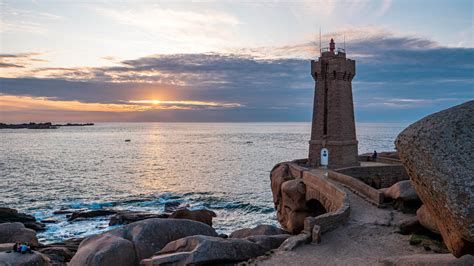 Download wallpaper sea, sunrise, stones, dawn, France, lighthouse ...