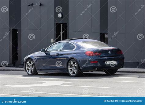 BMW 640i F13 Parked on the City Street. Dark Blue BMW 6 Series Coupe Car, Rear Side View ...