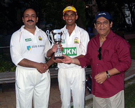 LSW St George's winning captain Nadeem Ahmed receives the Tony Turner ...