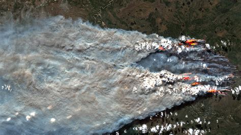 Satellites watch wildfires rage across Canadian…