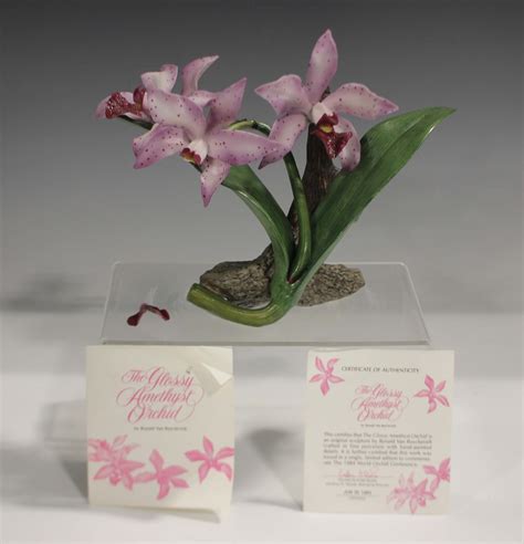A Franklin Mint porcelain Glossy Amethyst Orchid, modelled by Ronald Van Ruyckevelt, with certificat