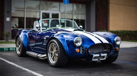 Download Shelby Cobra Racing Car Wallpaper | Wallpapers.com