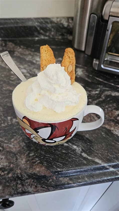 Frozen Pineapple and milk blended with a whipped cream top and two ...