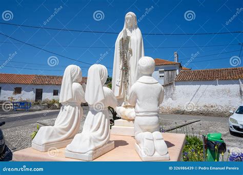 White Stone Statue Of The 3 Shepherd Children Kneeling And Praying Next ...