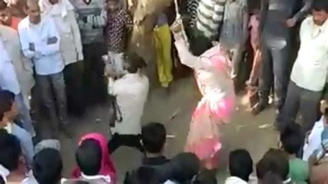 Caught on camera: Husband flogs wife in public on panchayat's orders to ...