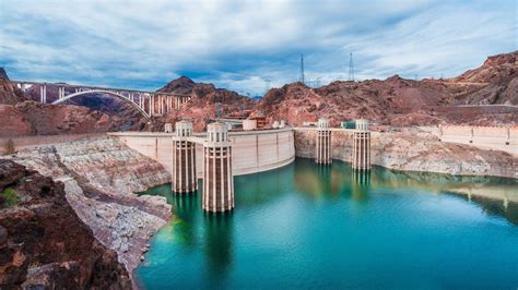 Download Hoover Dam With Vast Sky Wallpaper | Wallpapers.com