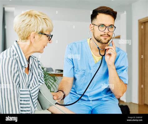 nurse doctor senior care caregiver help check exam blood pressure check ...