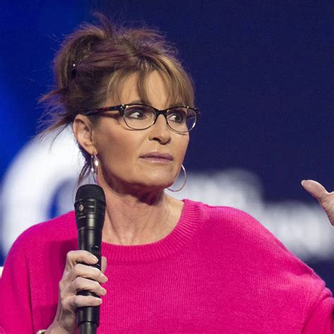 Download Sarah Palin Wearing A Pink Sweater Wallpaper | Wallpapers.com