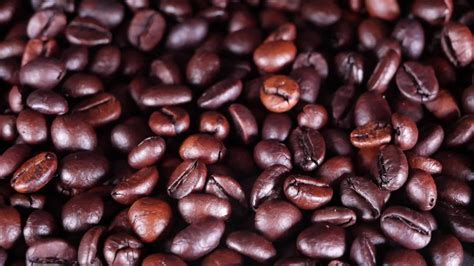 Freshly roasted coffee beans close up 20519042 Stock Video at Vecteezy