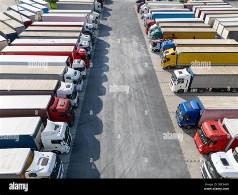 Aerial view of a large truck parking lot at a logistics hub, with ...