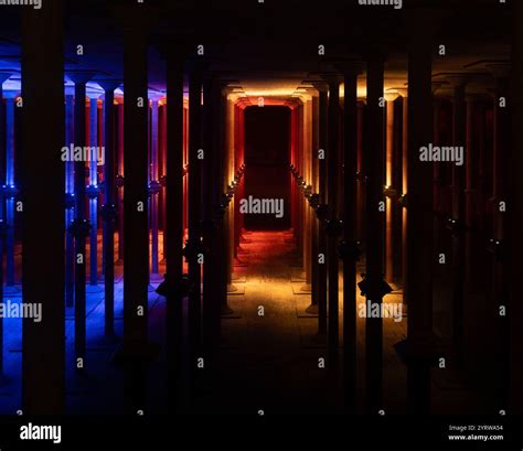 Buffalo Bayou Park Cistern partially lit with blue, red, and gold ...
