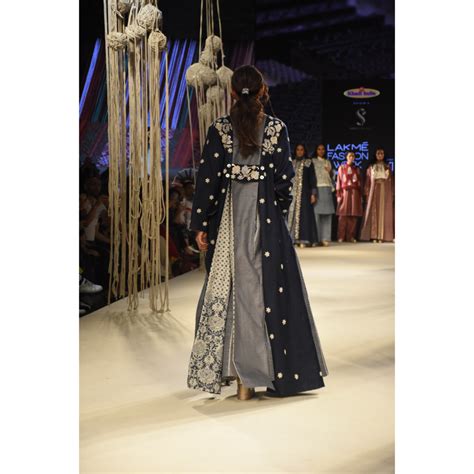 Blue embroidered long jacket with a front open checked kalidar skirt a