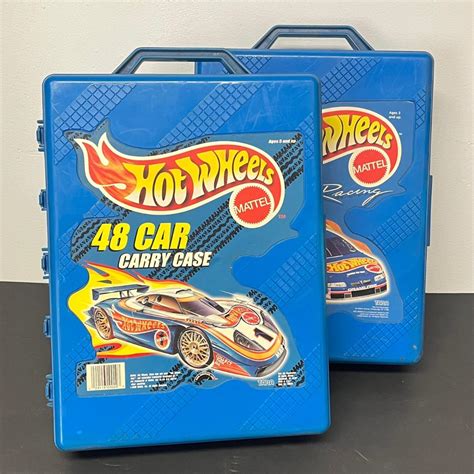 LOT 66: Two Hot Wheels Carrying Cases Loaded with Cars | EstateSales.org