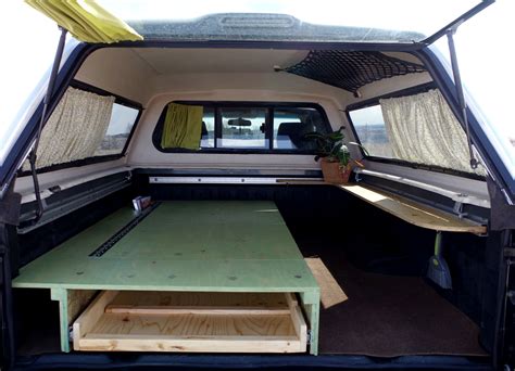 tiny truck camper | mini home in truck bed | truck canopy camper ideas | sleeping platform ...