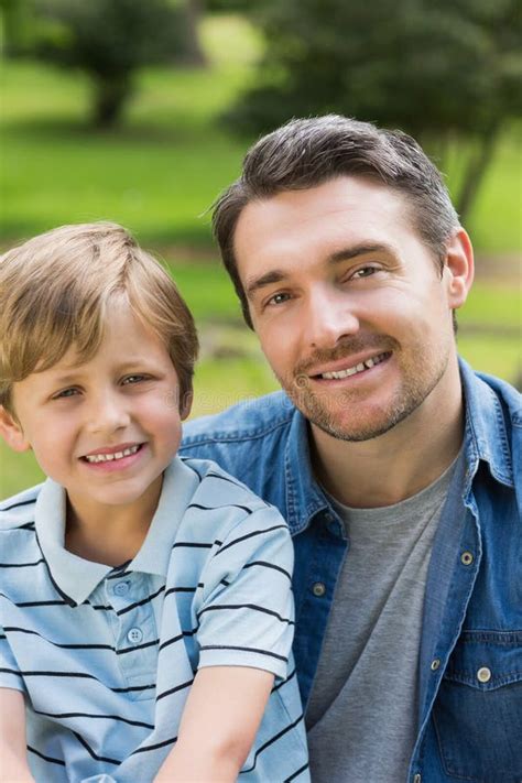 Close-up Portrait of Father and Boy at Park Stock Photo - Image of male ...