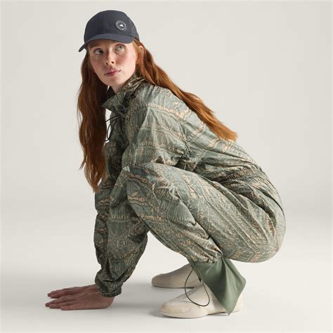 CLOTHING - adidas by Stella McCartney Woven Onesie Printed - Beige ...