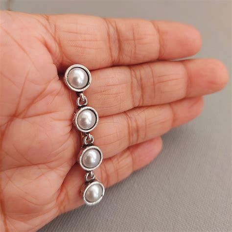 Pearl Charisma: Oxidized Four-Pearl Dangler Earrings – AashirsLifestyle