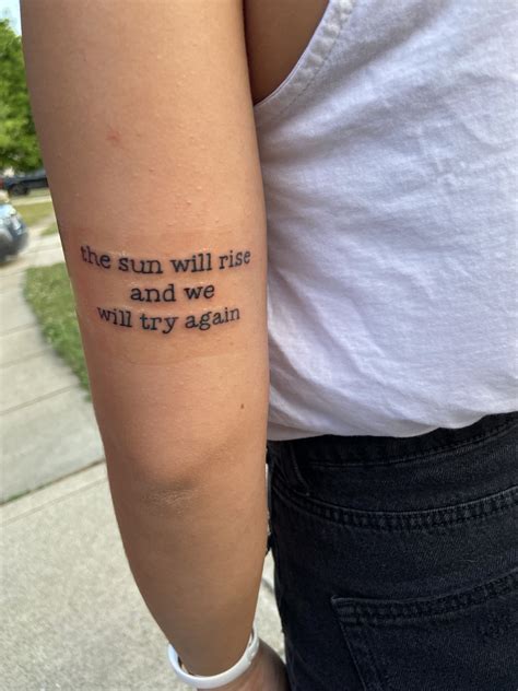 inner arm writing tattoo