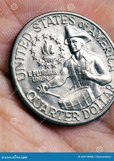 The USA Quarter Dollar Coin with Drummer Lies in a Palm Close-up ...