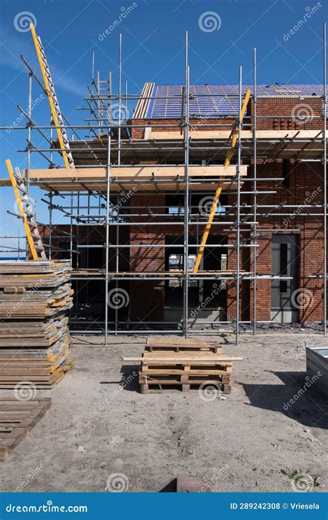 Scaffolding and Ladders on a Construction Site of a Row of New Houses To Be Built Stock Photo ...