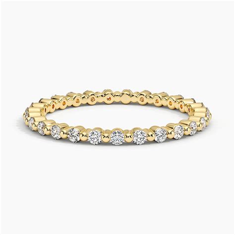 "Elegant gold diamond eternity ring offering timeless sparkle, delicat ...