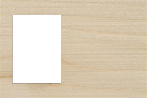Blank folded paper poster hanging on wooden wall,template mockup for ...