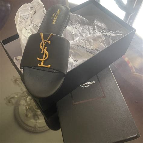 Yves Saint Laurent Women's Black and Gold Slides | Depop