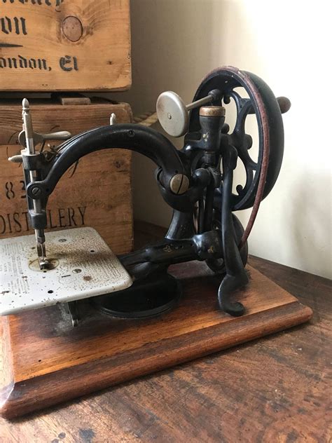 Image result for Hand-Cranked Sewing Machine