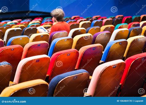 The Auditorium in the Theater. Multicolored Spectator Chairs Stock ...