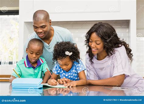 Parents Helping Children Doing Homework Stock Image - Image of childhood, casual: 62321783