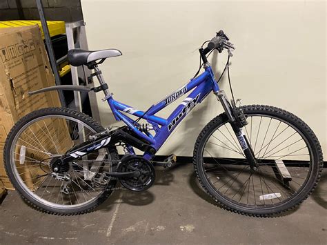 HUFFY TUNDRA, BLUE, 21 SPEED, FULL SUSPENSION MOUNTAIN BIKE