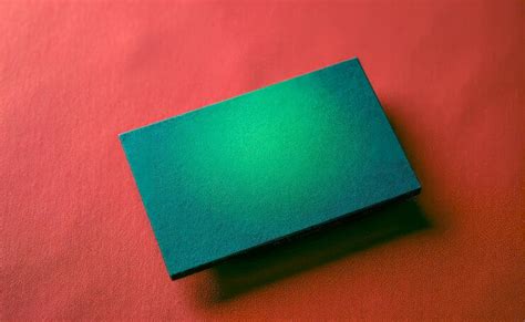 Green business card bank card on a red textured background | Premium AI ...