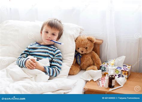 Sick Child Boy Lying in Bed with a Fever, Resting Stock Image - Image ...