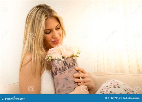 Young Woman Smells of Rose. Stock Image - Image of arrangement, blond: 114777815