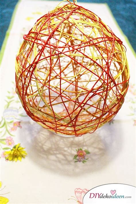 DIY Dekoidee - Ostereier basteln aus Knitterpapier und Naturschnur ...