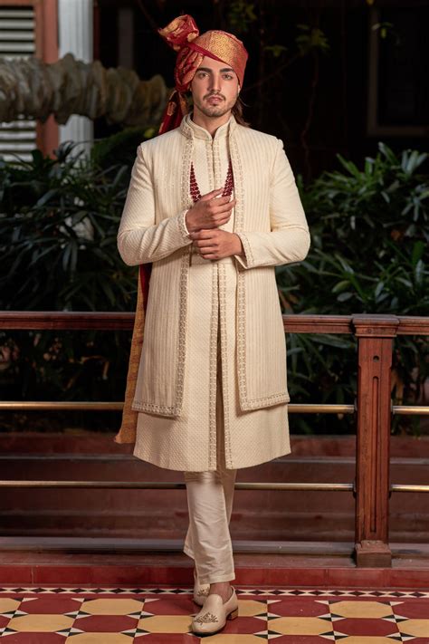 Cream sherwani in lucknowi with sequence and resham work