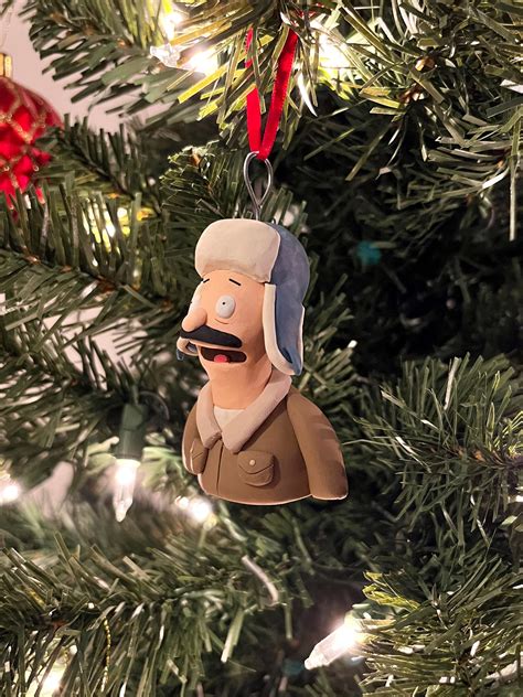 Bob's Burgers ornaments I made for this year: Millie, Bob, Rudy, Gene ...