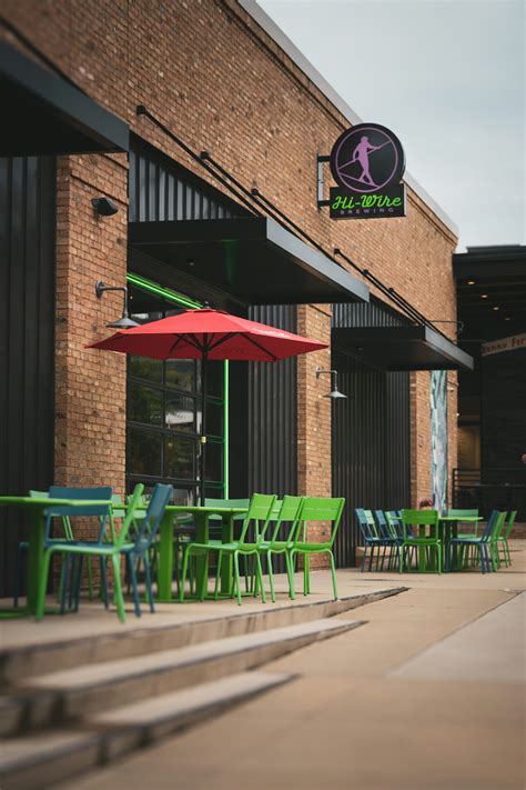 A group of green chairs sitting outside of a building photo - Free Hi ...