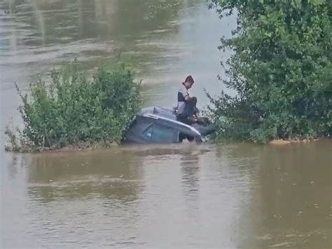 Odisha: Two men rescued after their car gets stuck on flooded road