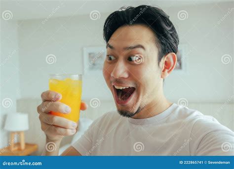 Funny Face of Man Drink Fresh Orange Juice in the Hotel for Summer ...