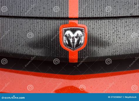 Closeup of Rain Drops of Dodge Challenger Logo on Orange and Black Car ...
