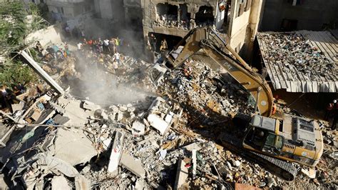 In pictures: Dead bodies lifted from the rubble in aftermath of Israeli ...