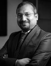 FCA (Membership No.: 157649), B.Com.