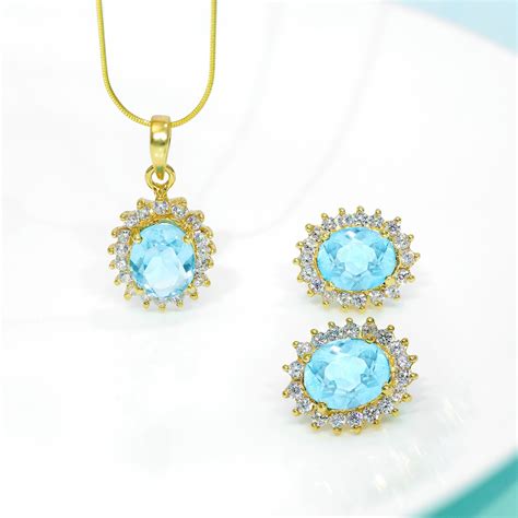 Gold Plated Silver Sky Blue Stone Studded Pendant & Earrings Set