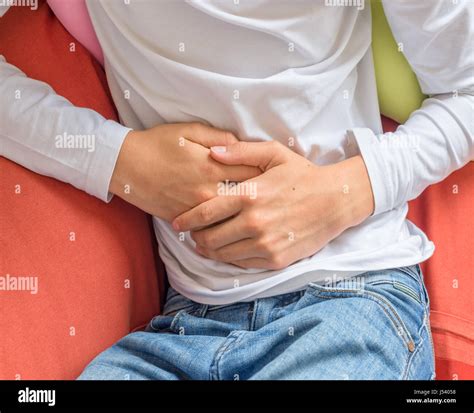 Young man suffering from stomach ache, diarrhea, constipation, acid ...