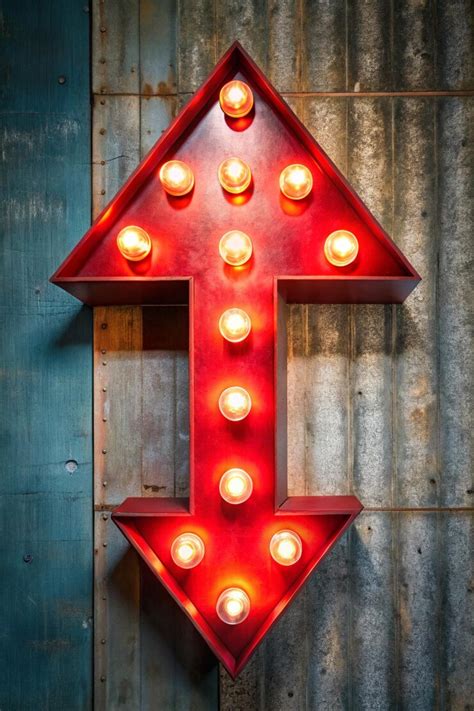 Red arrow with light bulbs signpost for your needs | Premium AI ...