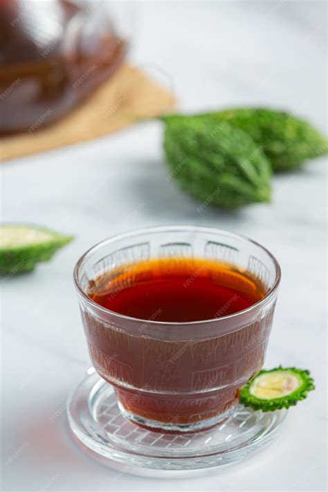 Free Photo | A cup of hot bitter gourd tea with raw sliced bitter gourd ...