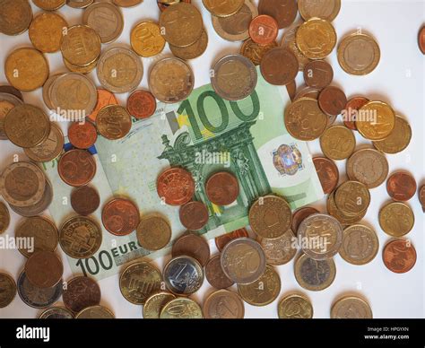 Euro (EUR) banknotes and coins, currency of European Union (EU) useful as a background Stock ...